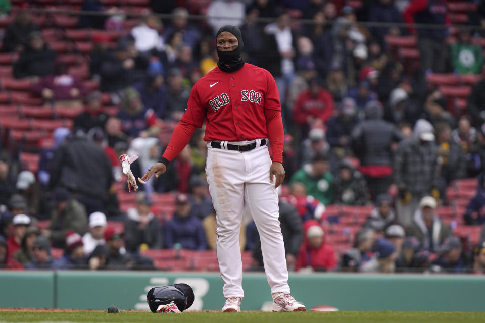 Boston Red Sox's Rafael Devers drops his helmet and gloves after he lined out to second in the third inning of a baseball game against the Pittsburgh Pirates, Wednesday, April 5, 2023, in Boston. (AP Photo/Steven Senne)