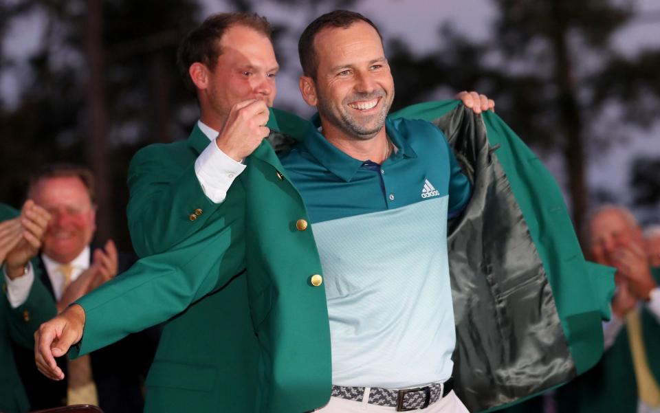 Danny Willett presents Sergio Garcia with the green jacket - Getty Images North America