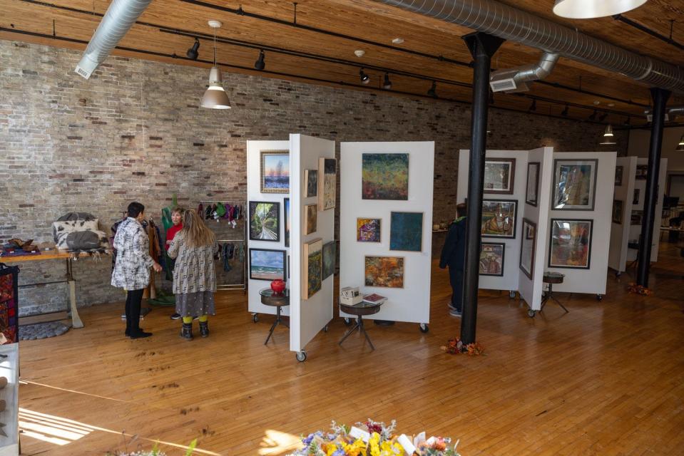 Around 80% of the 28 current vendors are local, including artists who create fused glass, charcoal art dishware, flower arrangements, pottery and ceramics, fiber art, metals, woodwork, and a variety of paintings and wall art displayed on towering, mobile gallery walls beneath lofted ceilings.