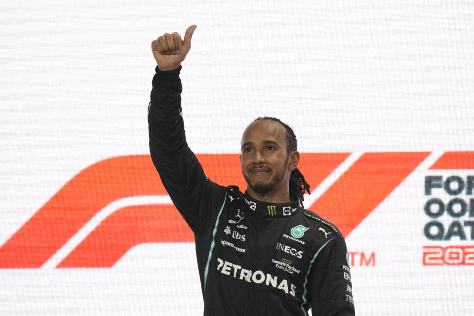 Mercedes driver Lewis Hamilton of Britain reacts after winning the Qatar Formula One Grand Prix. In Lusail, Qatar, Sunday, Nov. 21, 2021. (AP Photo/Darko Bandic)