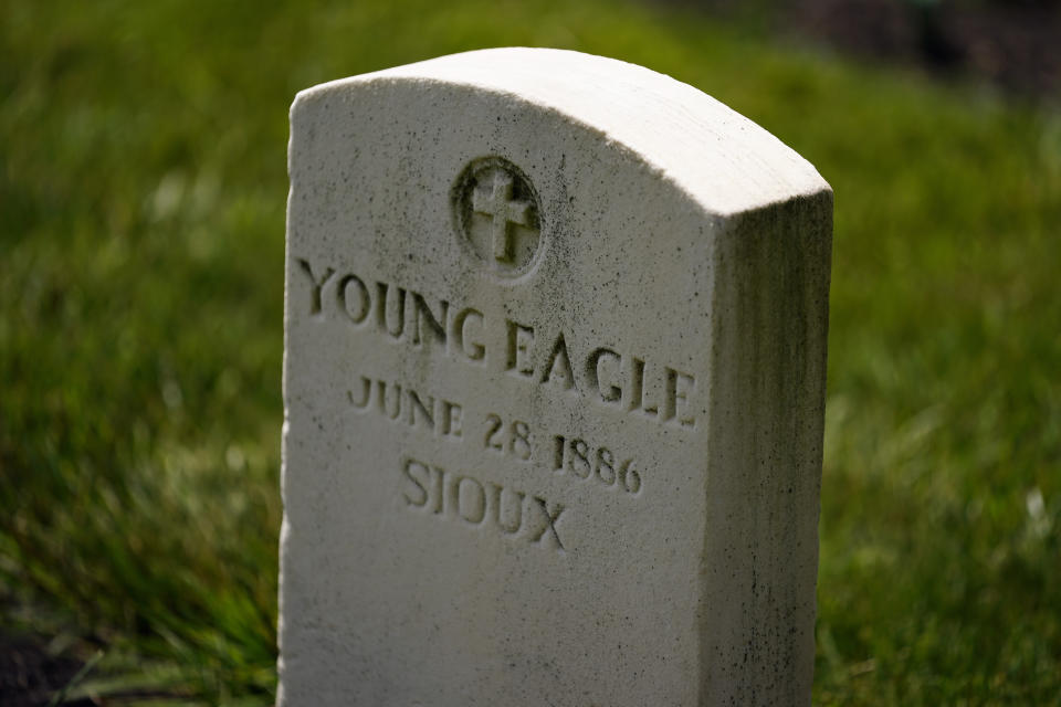 FILE - A headstone is seen at the cemetery of the U.S. Army's Carlisle Barracks, Friday, June 10, 2022, in Carlisle, Pa. The remains of five more Native American children who died at a notorious government-run boarding school in Pennsylvania more than a century ago will be disinterred from a small Army cemetery and returned to descendants, authorities said. (AP Photo/Matt Slocum, File)