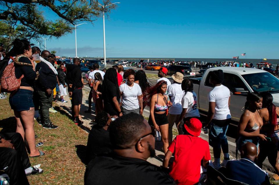 Hundreds of people walk along Highway 90 during Black Spring Break in Biloxi on Saturday, April 9, 2022.