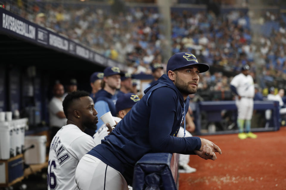 Tampa Bay Rays' Kevin Kiermaier watches a video tribute to him during the second inning of the team's baseball game against the Toronto Blue Jays on Saturday, Sept. 24, 2022, in St. Petersburg, Fla. Kiermaier is out for the season. (AP Photo/Scott Audette)