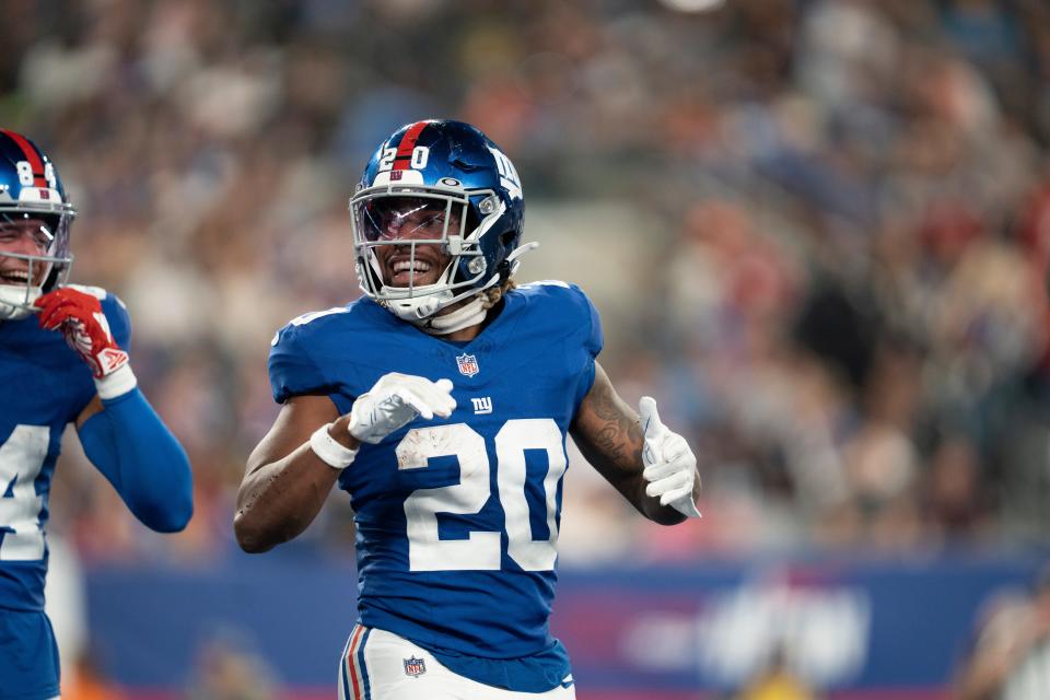 Aug 18, 2023; East Rutherford, NJ, USA; The Carolina Panthers vs. the New York Giants in an NFL preseason game at MetLife Stadium. New York Giants Eric Gray (20) celebrates after scoring touchdown in the second quarter. Mandatory Credit: Michael Karas-The Record