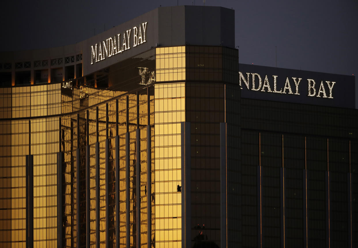 FILE - Broken windows from the Mandalay Bay resort and casino room from where Stephen Paddock fired on a nearby music festival are shown in Las Vegas, Oct. 3, 2017. Paddock a high-roller gambler who opened fire in 2017 on concertgoers in Las Vegas had lost tens of thousands of dollars while gambling weeks before the mass shooting and was upset with the way the casinos had been treating him, according to FBI documents made public this week. (AP Photo/John Locher, File)