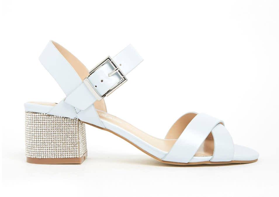 <p>River Island White Rhinestone Block Heel Sandals, $84, <a rel="nofollow noopener" href="http://us.riverisland.com/women/shoes--boots/heeled-sandals/white-diamante-block-heel-sandals-667341" target="_blank" data-ylk="slk:us.riverisland.com;elm:context_link;itc:0;sec:content-canvas" class="link ">us.riverisland.com</a></p>