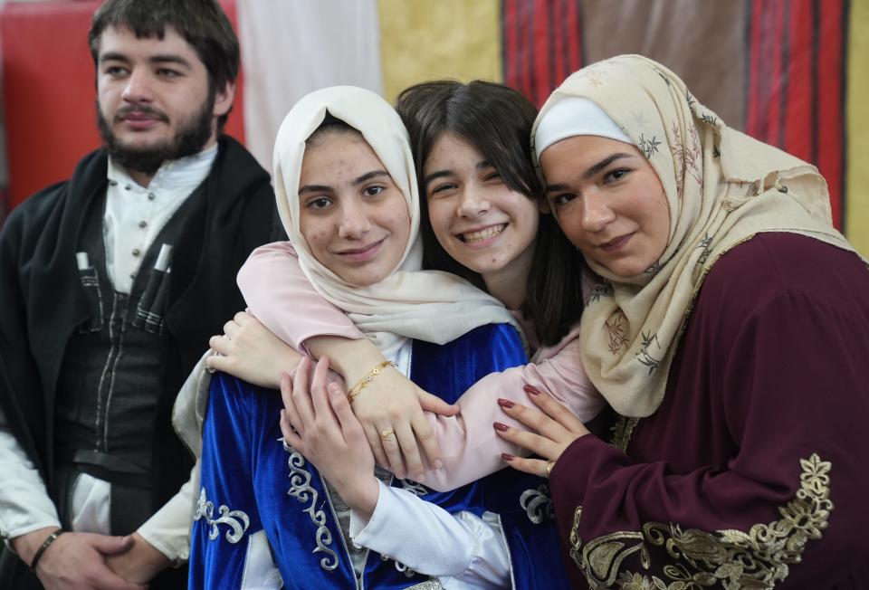 Haledon, NJ - April 28, 2023 — Students representing Circassia and Syria at the Manchester High School Multicultural Fair, featuring students with backgrounds from all over the world as they served food, danced and stamped passports in celebration of pupils from many cultures that attend the school in Haledon, NJ.