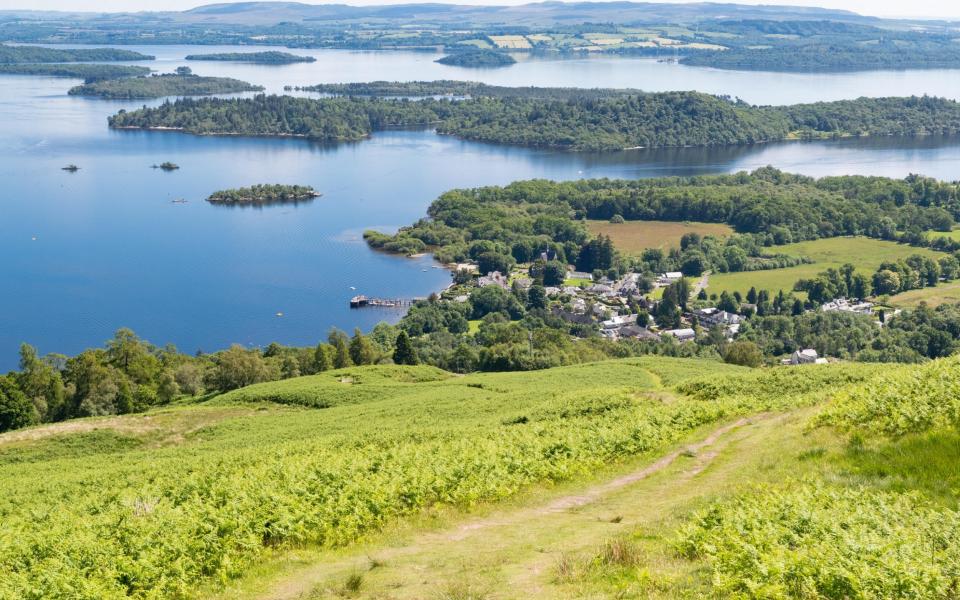 Luss village on Loch Lomond and the islands of Inchconnachan and Inchtavannach seen from Beinn Dubh one of the Glen Striddle hills in Scotland