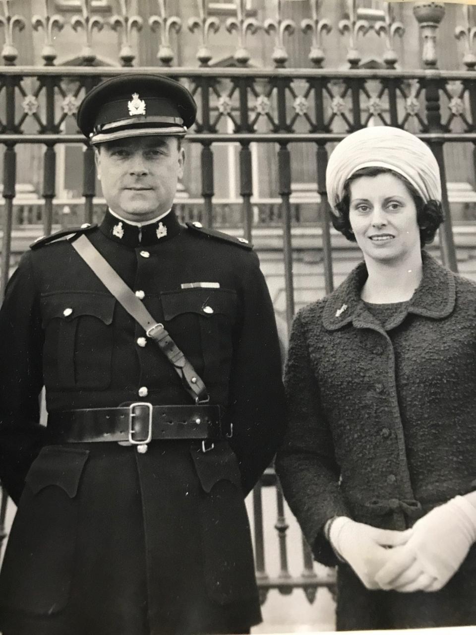 Southwood in Intelligence Corps dress uniform outside Buckingham Palace with his wife Maureen to receive his MBE for his work in Brixmis