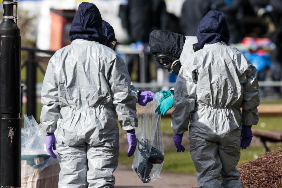 Police officers in protective suits and masks bag up a camera they used in investigations at the scene where former double-agent Sergei Skripal and his daughter, Yulia were discovered. (Photo by Jack Taylor/Getty Images)