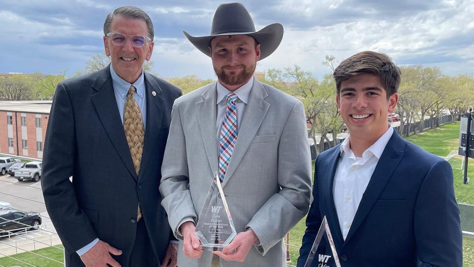 West Texas A&M University President Walter V. Wendler congratulates the top two student employee award winners for 2023-24: Zane Phillips, center, the Graduate Student Employee of the Year, and Caden Bonilla, the Undergraduate Student Employee of the Year.