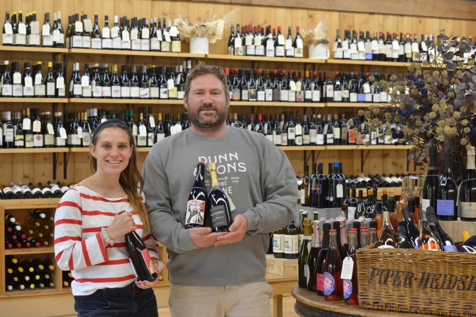 Adam and Erica Dunn in their boutique wine shop, Dunn & Sons Wine, at 13 Willow St. in Yarmouth Port.