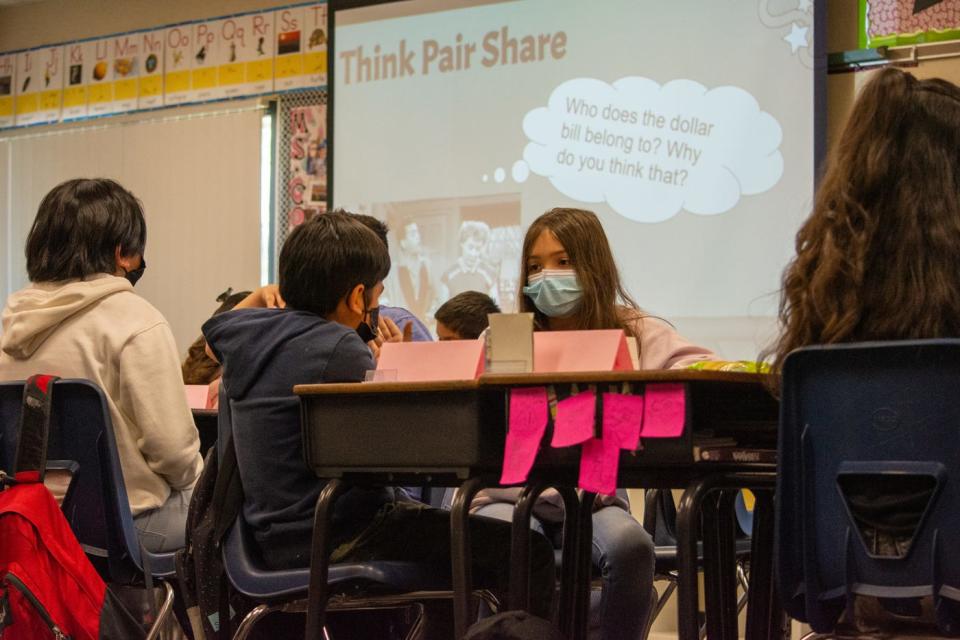 Fourth-grade students ponder ethics questions after watching part of an episode of "I Love Lucy" at Cathedral City Elementary in Cathedral City, Calif., on Tuesday, March 8, 2022.