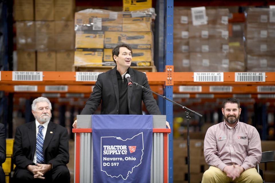 Hal Lawton, chief executive officer of Tractor Supply Co., speaks Wednesday morning to a large crowd during a grand opening ceremony for the company's new distribution center in Navarre.