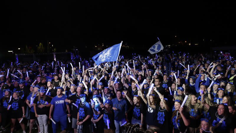 BYU fans gather in the wee hours Saturday morning to celebrate the Cougars officially becoming members of the Big 12 Conference.