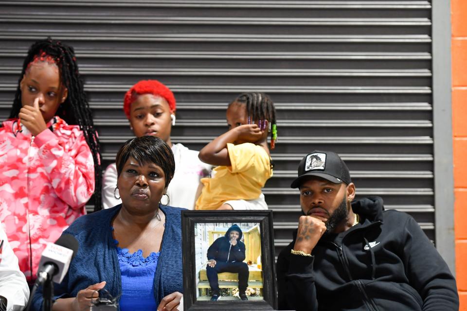 Terrance Sligh's family, Debra Roberts, mother, and Jamie Sligh, brother, front, and daughters, from left, Tamya, 17, Mariah, 14, and Averie, 3, speak about Terrance's death during a press conference at Jud Hub Social Innovation Center in Greenville on Monday, October 3, 2022.