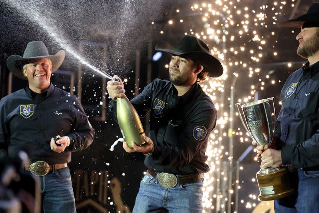 <p>Rob Carr/Getty</p> Adan Banuelos celebrates his victory during The American Performance Horseman by Teton Ridge at Globe Life Field on March 8, 2024.