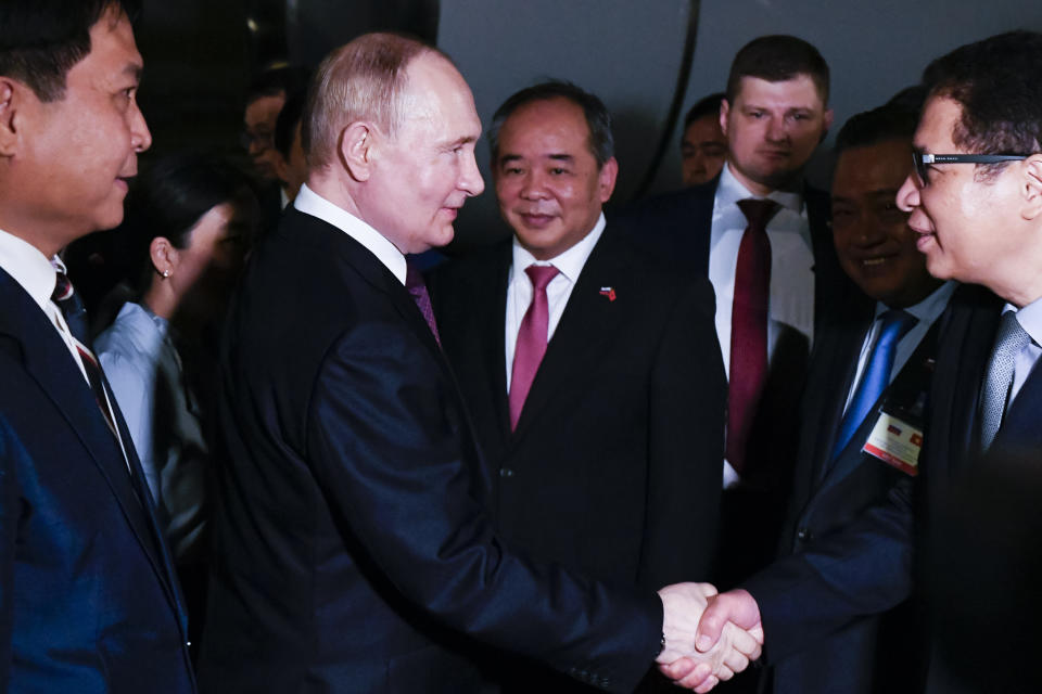 Russian President Vladimir Putin, second left, shakes hands with Vietnamese officials upon his arrival at Noi Bai International Airport in Hanoi, Thursday, June 20, 2024. (Nikita Orlov, Sputnik, Kremlin Pool Photo via AP)