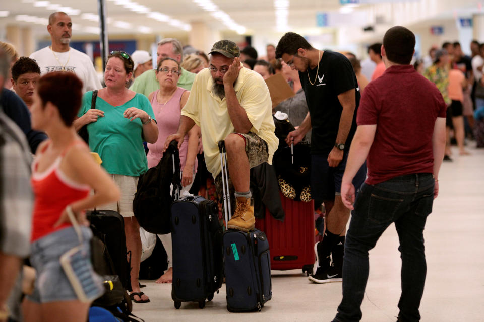 Stranded tourists and Puerto Ricans line up at the International Airport in San Juan on Sept. 25 as they try to leave after Hurricane Maria devastated power and communications across the island. (Photo: Alvin Baez / Reuters)