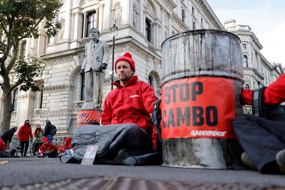 Greenpeace activists stage a Downing Street sit-in to protest against the Cambo oil field project in the Shetland Islands (AFP/Getty)