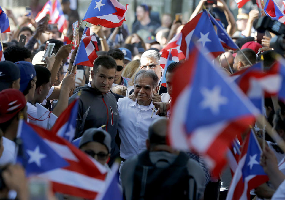 Nationalist Oscar Lopez arrives for a gathering in his honor