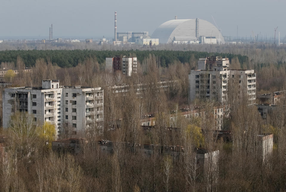 A New Safe Confinement (NSC) structure over the old sarcophagus covering the damaged fourth reactor at the Chernobyl nuclear power plant is seen from Ukraine's abandoned town of Pripyat, Ukraine, April 5, 2017.  REUTERS/Gleb Garanich