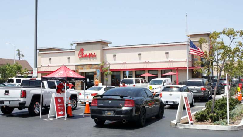 Cars parked outside a Chick-fil-A restaurant