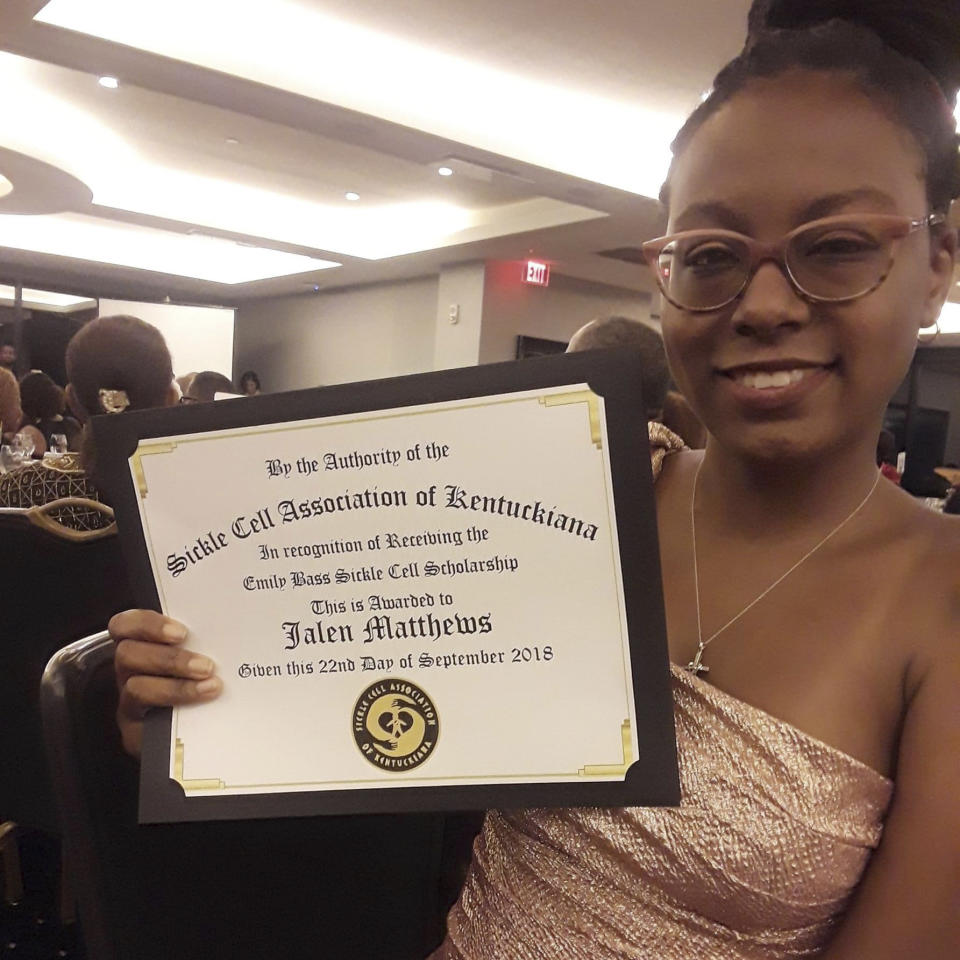 In this photo provided by Jalen Matthews, she receives an award at the annual Sickle Cell Association of Kentuckiana gala in Kentucky in 2018. She was diagnosed with sickle cell at birth. (Courtesy Jalen Matthews via AP)
