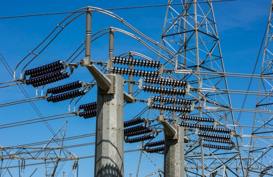 High tension electrical power lines at a transfer station along Highway 58 are viewed on March 28, 2017, near Buttonwillow, California. Oil and natural gas production have been joined by solar panels and wind turbines to provide large scale electrical energy for the entire Western United States. (Photo by George Rose/Getty Images)