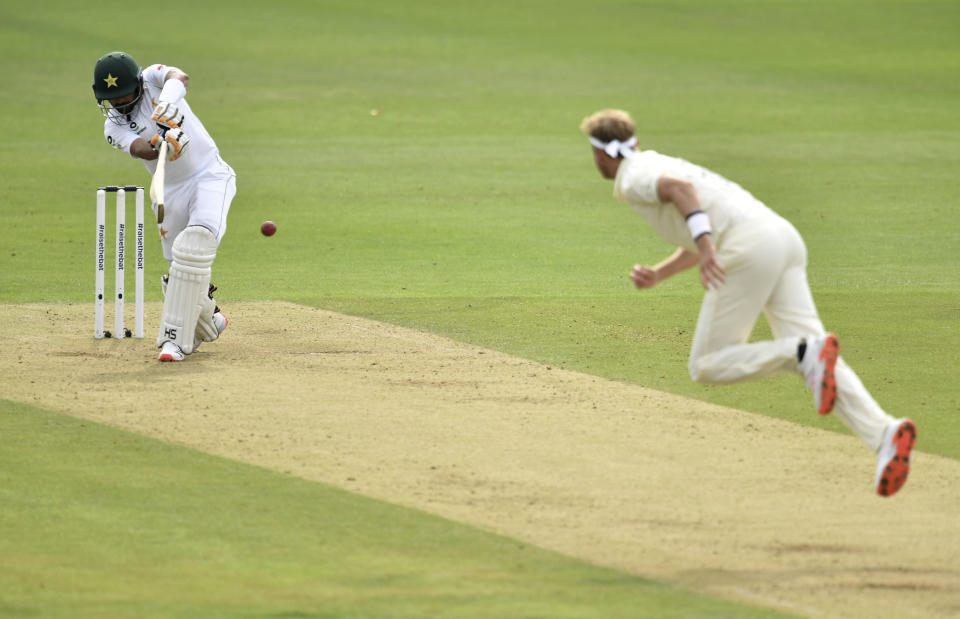 England's Stuart Broad, right, bowls to Pakistan's Babar Azam during the first day of the second cricket Test match between England and Pakistan, at the Ageas Bowl in Southampton, England, Thursday, Aug. 13, 2020. (Glyn Kirk/Pool via AP)