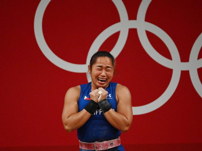 Hidilyn Diaz cries after winning gold at the Tokyo Olympics.