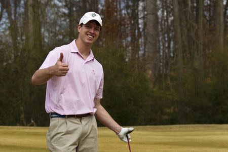 An undated handout family photo shows Witner Milner giving a thumbs up at a golf course. Milner, 25, died in the family's backyard pool in Atlanta in 2011 while breath holding to train for spear fishing. REUTERS/Hicks Milner/Handout