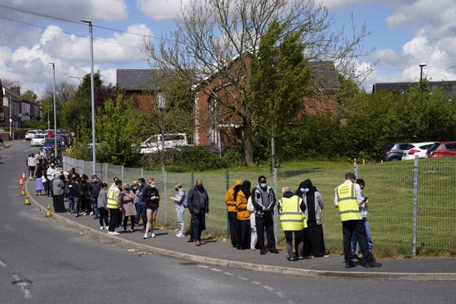 People queuing for Covid vaccinations in Bolton