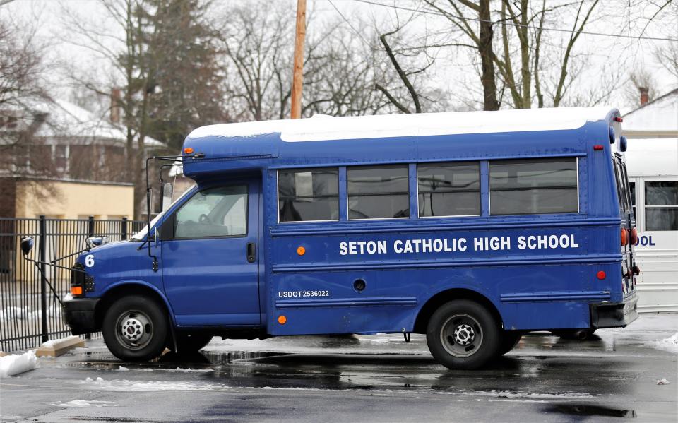 Snow covers the roof of a Seton Catholic High School bus Jan. 25, 2023.