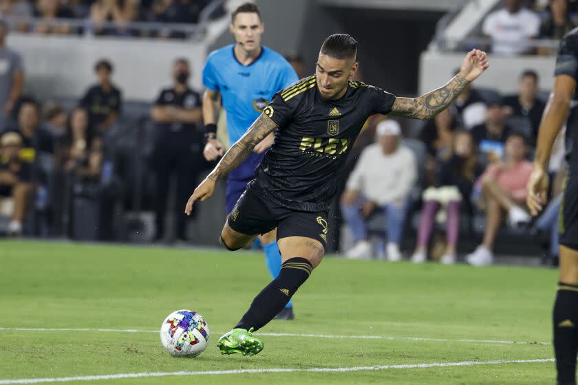 Los Angeles FC forward Cristian Arango (9) shoots during an MLS soccer match against the Seattle Sounders Friday, July 29, 2022, in Los Angeles. (AP Photo/Ringo H.W. Chiu)