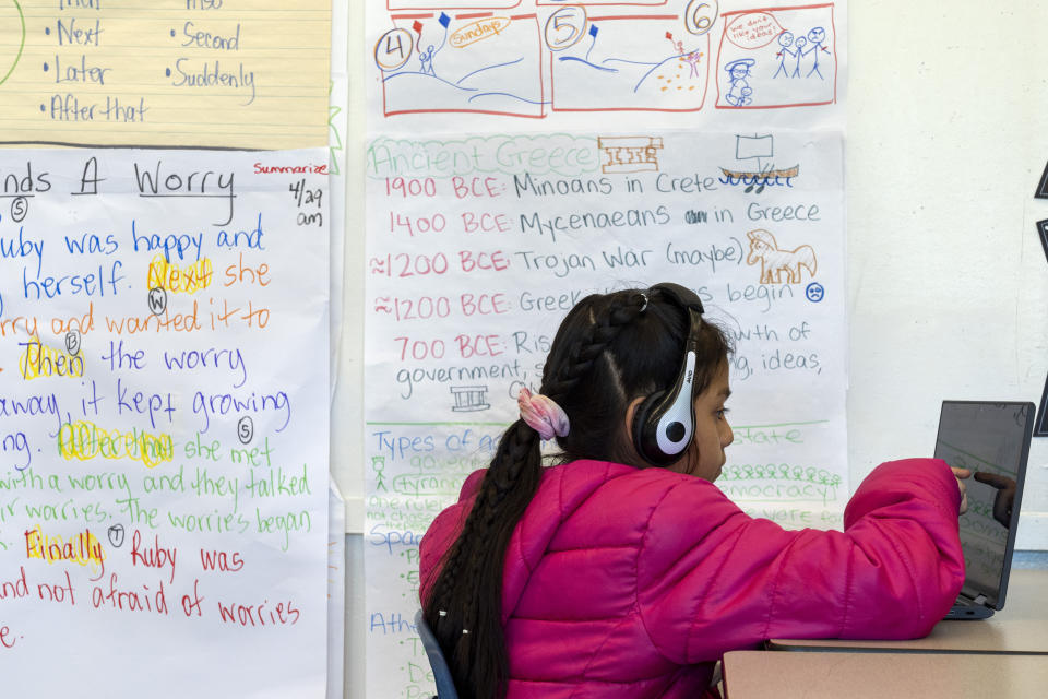 Jaelene, 9, works on a computer during a third grade English language arts class at Mount Vernon Community School, in Alexandria, Va., Wednesday, May 1, 2024. (AP Photo/Jacquelyn Martin)