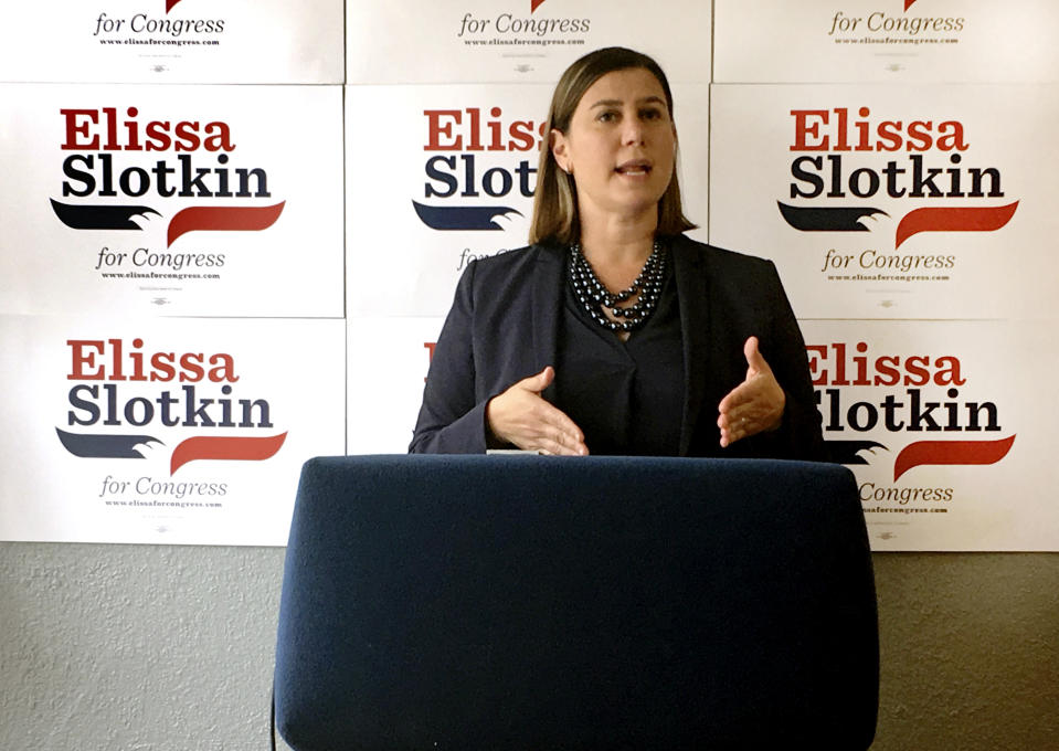 In this July 31, 2018, photo, Elissa Slotkin, a Democratic candidate for Congress from Michigan, speaks during a news conference at her campaign headquarters in Lansing, Mich. The former CIA analyst and Pentagon official is one of dozens of first-time candidates running in districts that seem to offer the best chance for flipping GOP seats this fall. (AP Photo/Mike Householder)