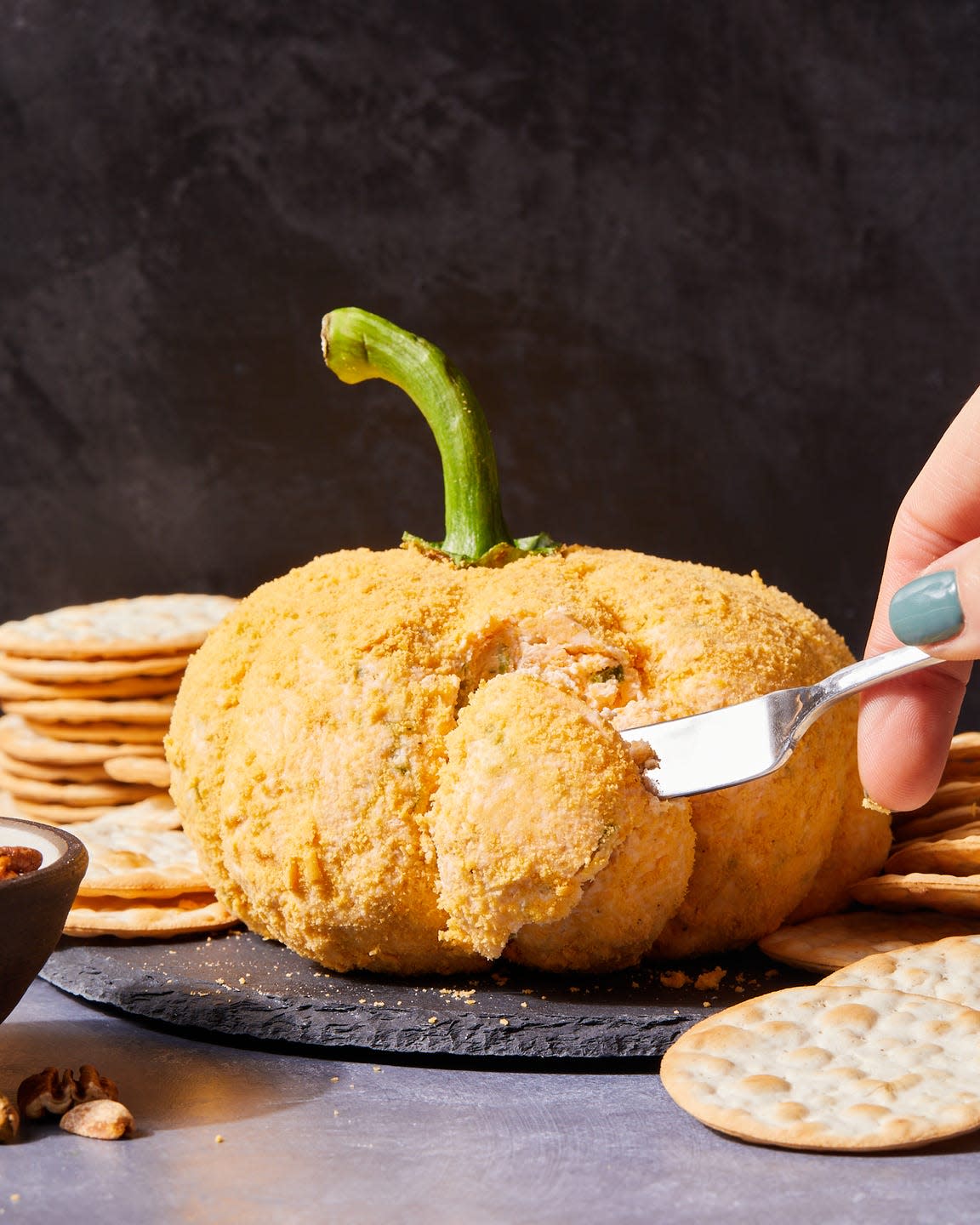 pumpkin cheese ball with crackers