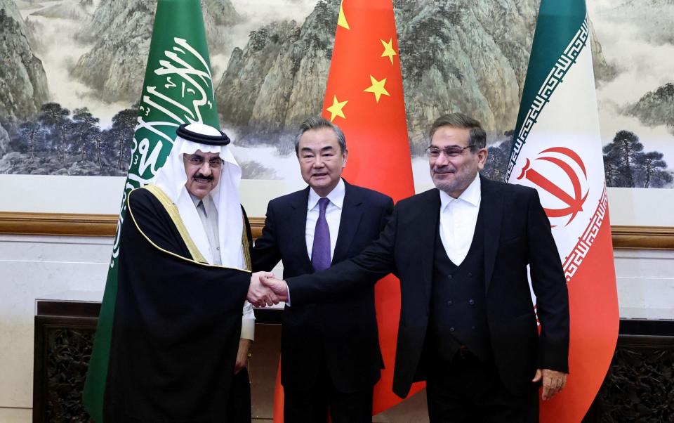 Wang Yi, a member of the Political Bureau of the Communist Party of China (CPC) Central Committee and director of the Office of the Central Foreign Affairs Commission, Ali Shamkhani, the secretary of Iranâ€™s Supreme National Security Council, and Minister of State and national security adviser of Saudi Arabia Musaad bin Mohammed Al Aiban pose for pictures during a meeting in Beijing, China March 10, 2023 - China Daily/Reuters