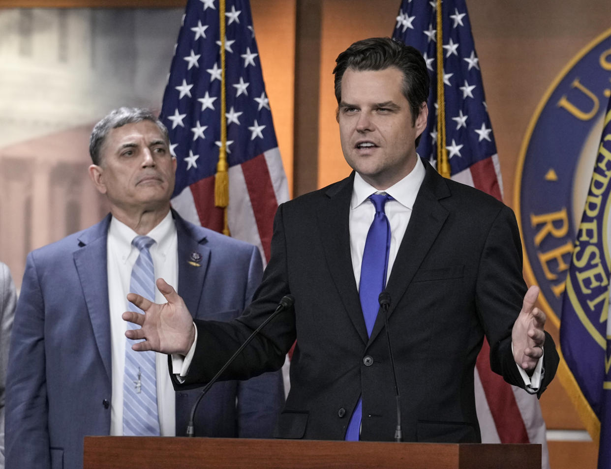 Rep. Matt Gaetz, R-Fla., speaks as Rep. Andrew Clyde, R-Ga., looks on  at the Capitol on Nov. 17, 2022.  (J. Scott Applewhite / AP file)