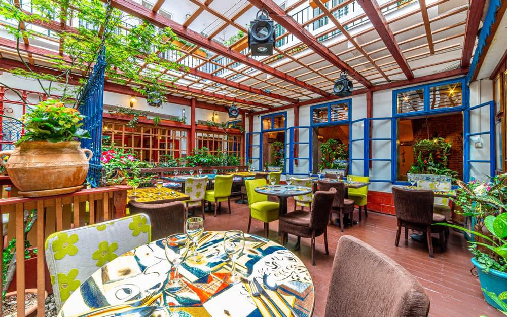 Hotel Salvator's restaurant, La Boca, has oodles of character thanks to colourful tilework on the floors and walls supported by vibrant posters, murals and table coverings
