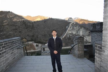 Chinese labour activist Zhang Zhiru poses for pictures at the Great Wall in Beijing, in this handout picture taken in 2008 and provided to Reuters on April 23, 2014. REUTERS/Courtesy of Zhang Zhiru's family/Handout via Reuters