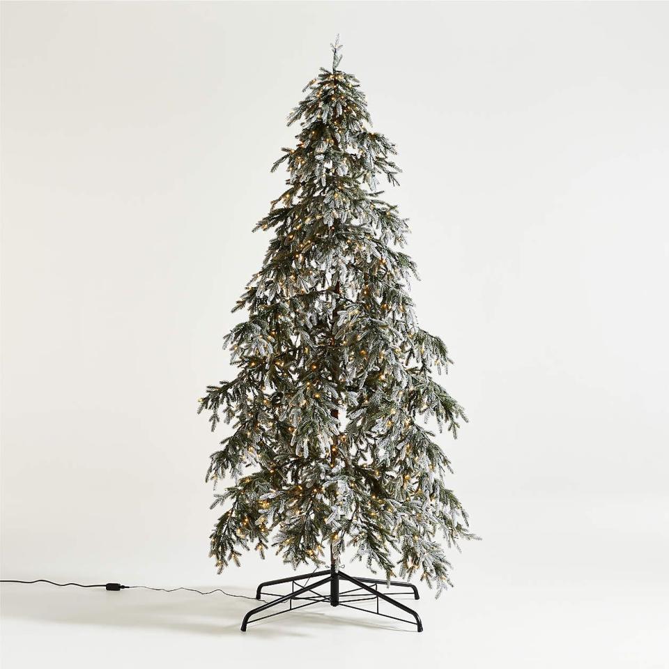 <p><a href="https://go.redirectingat.com?id=74968X1596630&url=https%3A%2F%2Fwww.crateandbarrel.com%2Fflocked-downswept-pre-lit-led-christmas-tree-9%2Fs478966&sref=https%3A%2F%2F" rel="nofollow noopener" target="_blank" data-ylk="slk:Shop Now;elm:context_link;itc:0;sec:content-canvas" class="link ">Shop Now</a></p><p>Flocked Downswept Pre-Lit LED Christmas Tree 9'</p><p>crateandbarrel.com</p><p>$799.00</p><span class="copyright">Crate and Barrel</span>