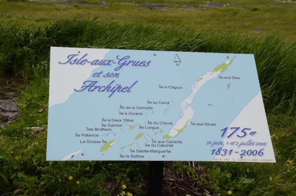 This photo taken August 2013, on Ile-aux-Grues in the St. Lawrence River on the outskirts of Quebec City shows visitors a map of the archipelago. The island offers quiet roads and stunning river vistas for cyclists and lovers of solitude. (AP Photo/Calvin Woodward)