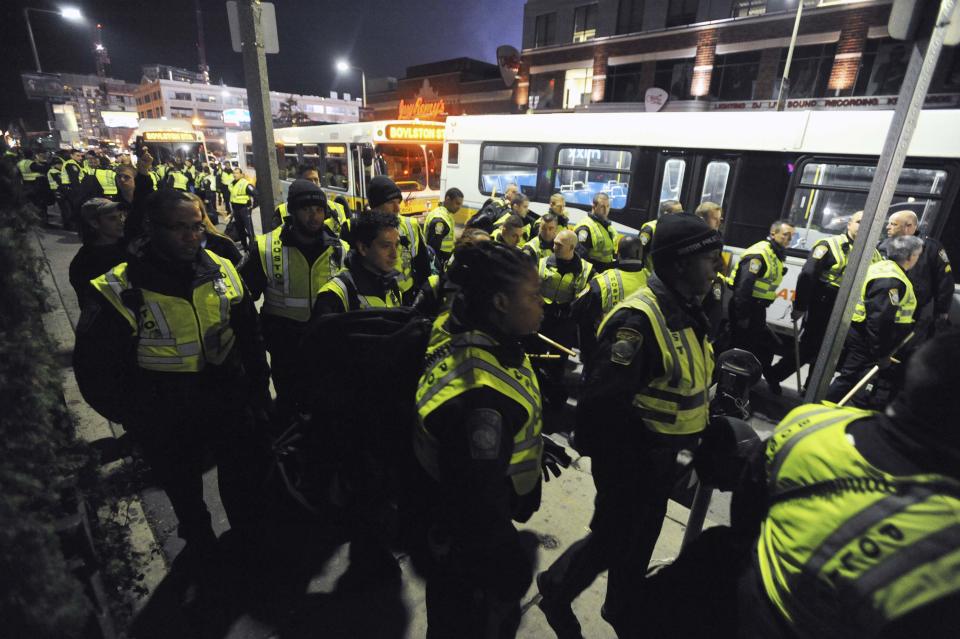 Dozens of Police officers arrive at Boylston St near Fenway Park as Red Sox and Cardinals play Game 6 of the MLB baseball's World Series in Boston