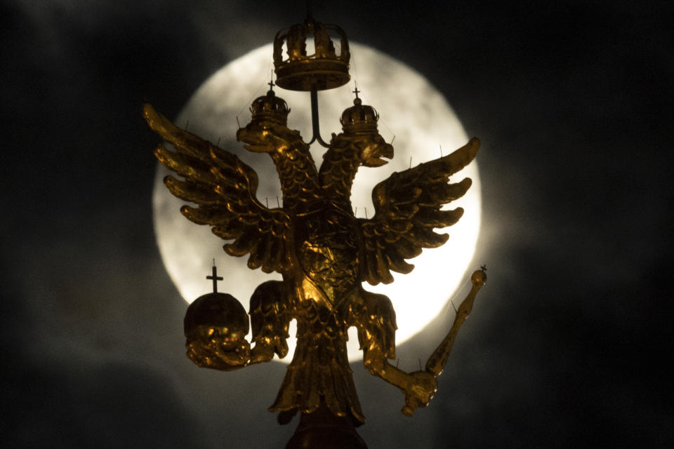 Feb. 19, 2019. Russia's state symbol, the double-headed eagle, is pictured against the full moon, in Moscow, Russia.