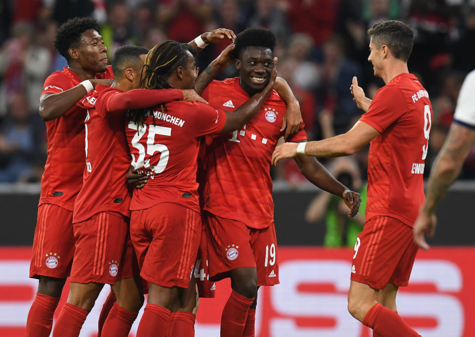 Canadian midfielder Alphonso Davies celebrates scoring with his teammates during the Audi Cup final between FC Bayern Munich and Tottenham Hotspur. (Photo by Christof Stache/AFP/Getty Images)      