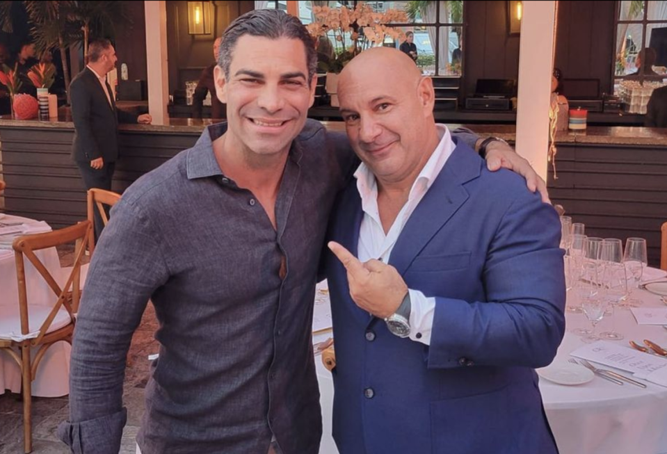 Francis Suarez poses with Venanzio Ciampa, a partner at the Gr8 Experience hospitality group, at their $6,000 per-person pop-up event during Formula One weekend. Instagram