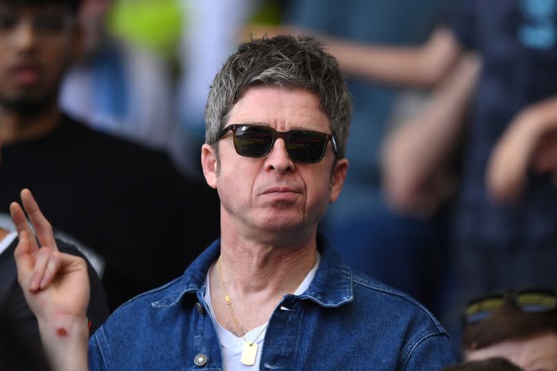 Musician Noel Gallagher looks on from the stand during the Premier League match between Fulham FC and Manchester City at Craven Cottage