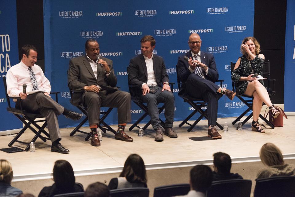 Moderator Andrew Meyer speaks to panelists Marco Sommerville, Kyle Kutuchief, Jason Segedy and Cheryl Powell during the "Building a New Vision for Downtown Akron" event at the Akron Art Museum.